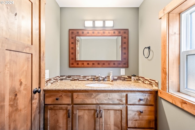 bathroom featuring a wealth of natural light and vanity