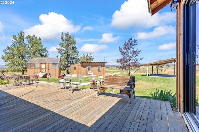 deck featuring a lawn and a storage shed