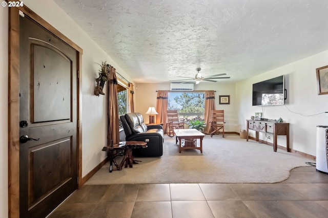 interior space with ceiling fan, a wall mounted AC, a textured ceiling, and carpet