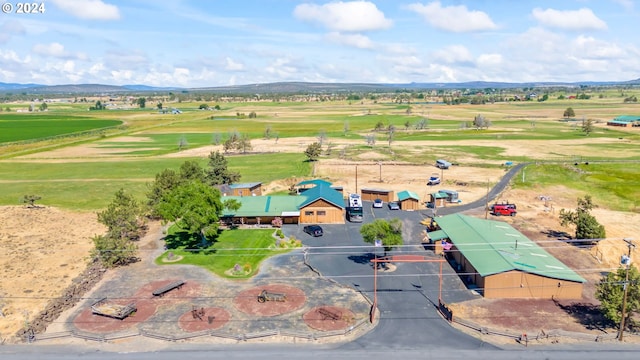 birds eye view of property featuring a mountain view