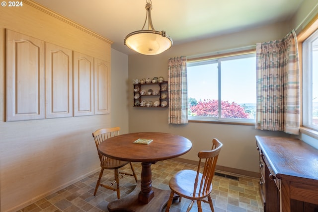 dining space with tile patterned floors and a wealth of natural light