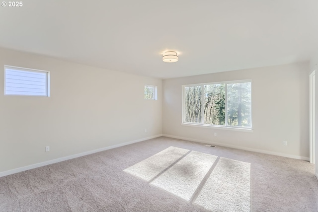 unfurnished room with light carpet