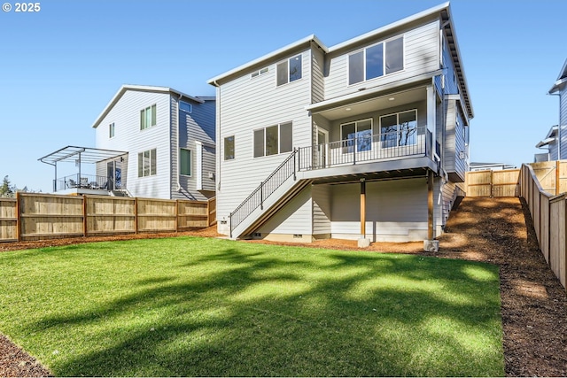 rear view of house featuring a yard and a pergola