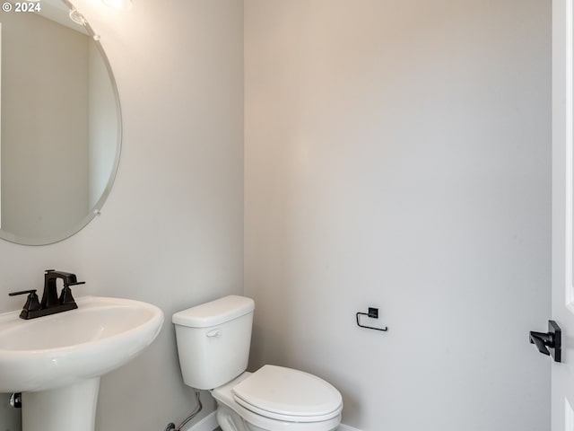 bathroom with toilet and sink