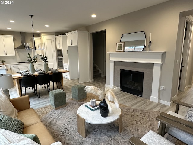 living room with light hardwood / wood-style floors