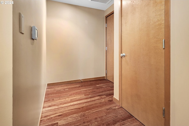 corridor featuring hardwood / wood-style flooring