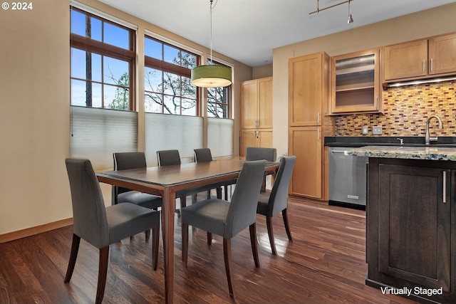 dining room with dark hardwood / wood-style flooring and sink