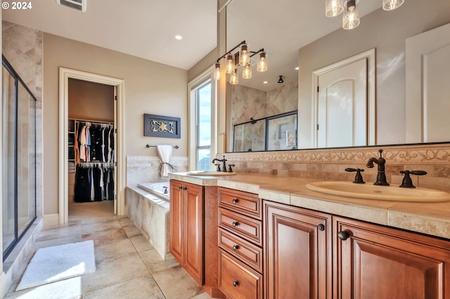 bathroom with vanity, independent shower and bath, and tile patterned flooring