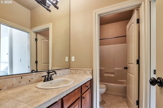 bathroom with vanity, toilet, and tile patterned flooring