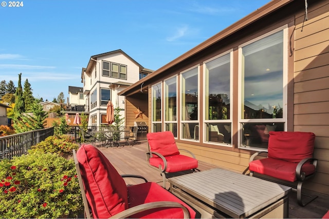 view of patio / terrace with a wooden deck and a grill