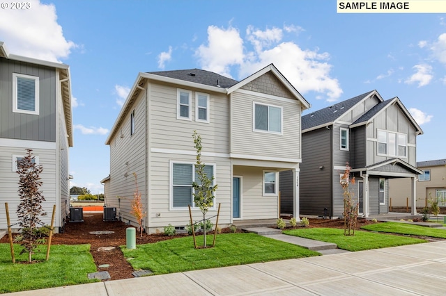 view of front of home featuring central AC unit and a front yard