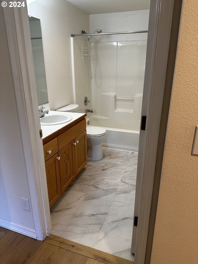 full bathroom featuring vanity, washtub / shower combination, toilet, and tile patterned flooring