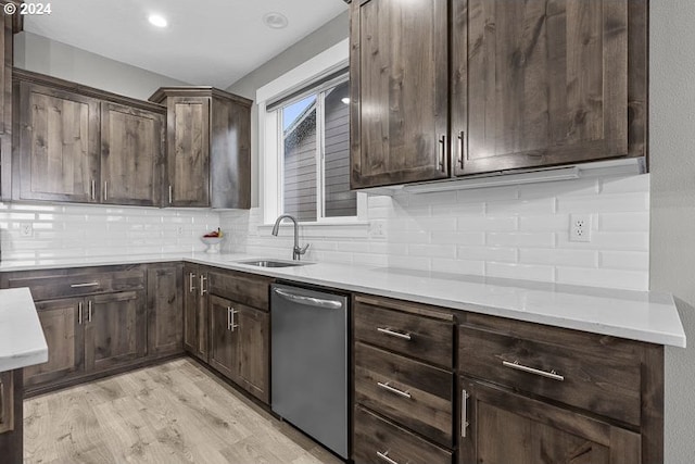 kitchen with dishwasher, sink, tasteful backsplash, light hardwood / wood-style floors, and dark brown cabinets