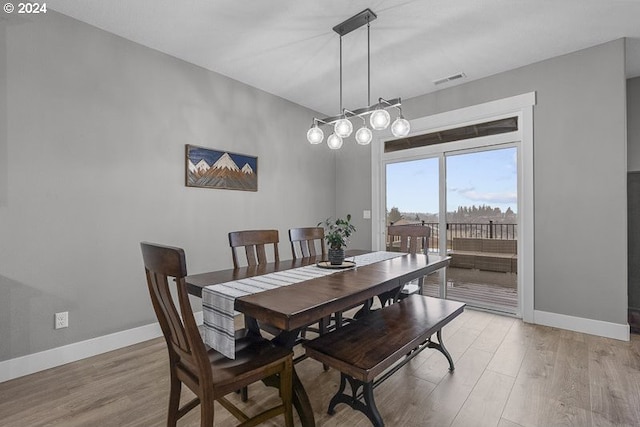 dining room with light wood-type flooring