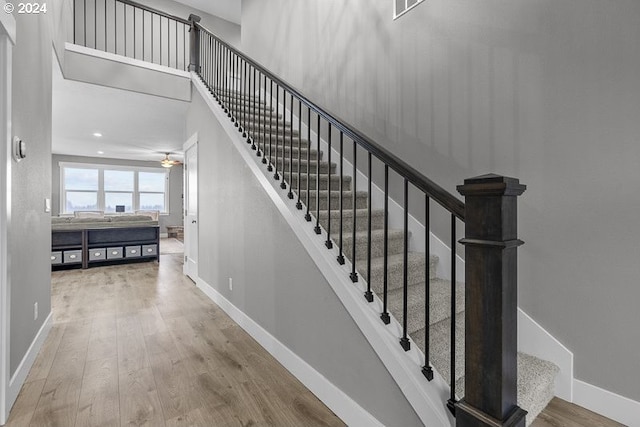 stairway featuring hardwood / wood-style flooring