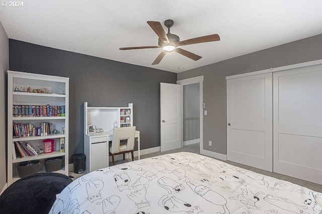 bedroom featuring ceiling fan, light colored carpet, and a closet