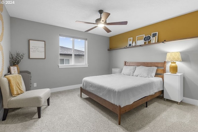 bedroom with ceiling fan and light colored carpet