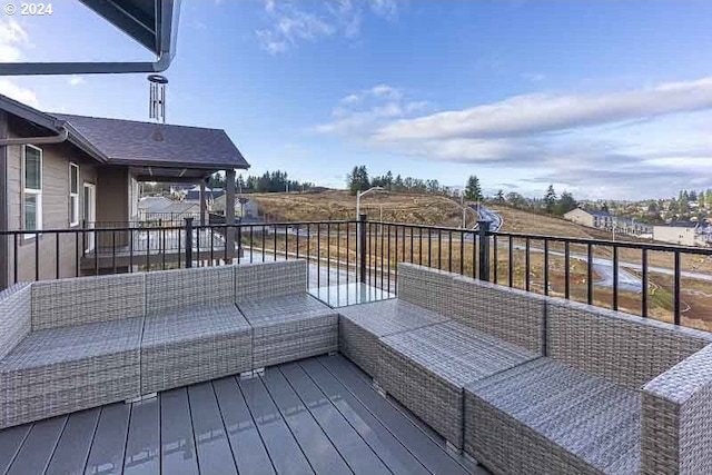 wooden terrace featuring an outdoor living space