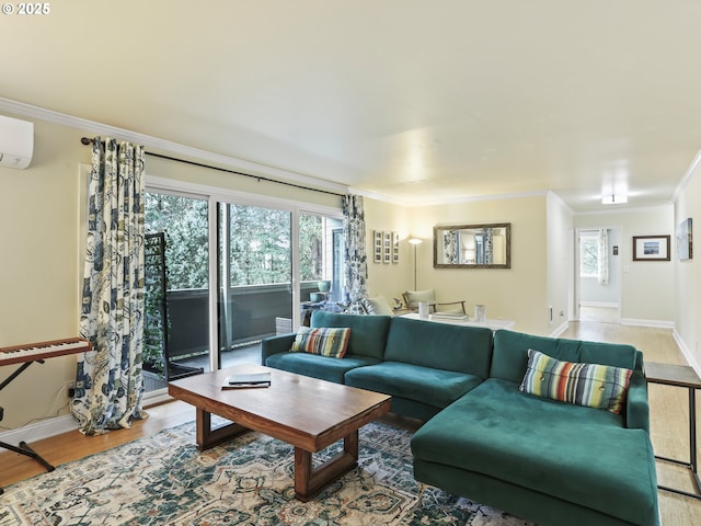 living area featuring a wall unit AC, baseboards, crown molding, and wood finished floors