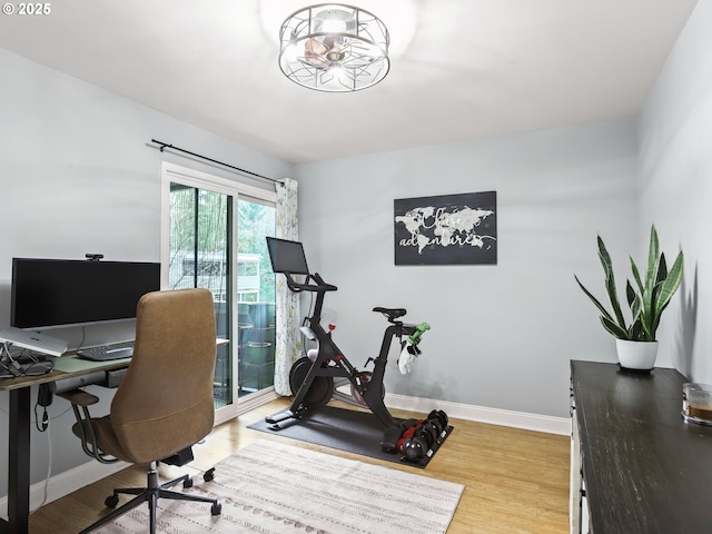 home office with wood finished floors and baseboards