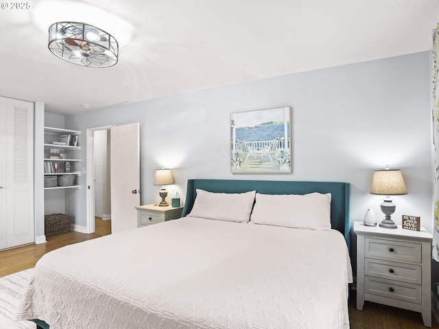 1500 SW Skyline Blvd # 21, Portland, OR 97221 - bedroom with baseboards, dark wood-style floors, and a closet
