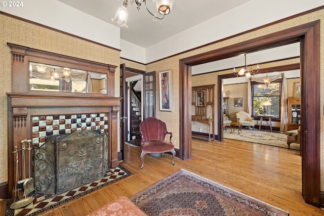 living room featuring a chandelier and hardwood / wood-style floors