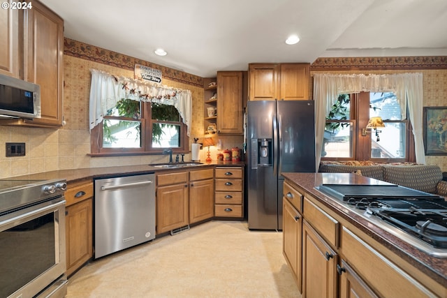 kitchen with appliances with stainless steel finishes and sink