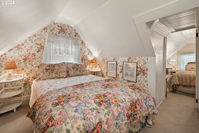 carpeted bedroom with multiple windows and lofted ceiling