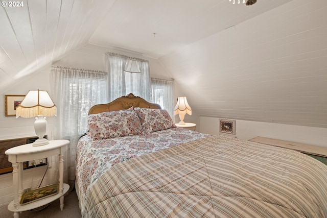 bedroom featuring lofted ceiling