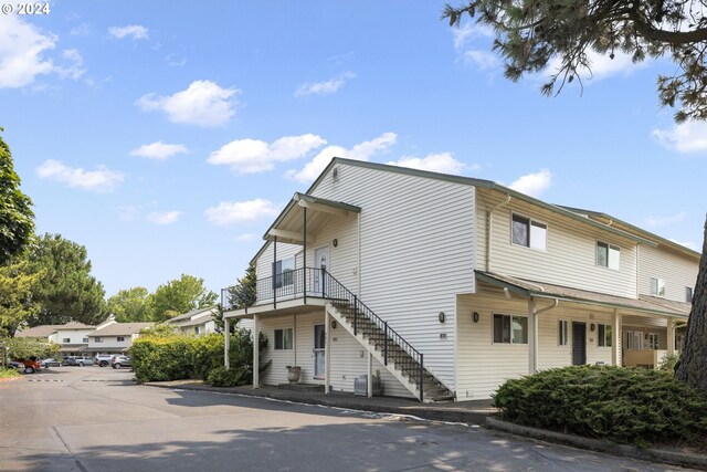 view of front of house with a balcony