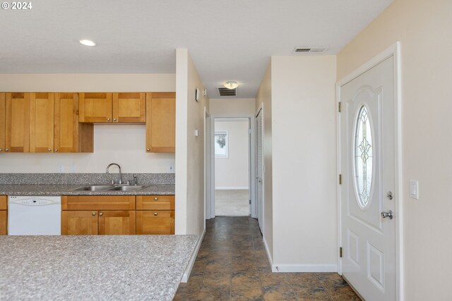 kitchen featuring dishwasher and sink