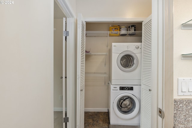 laundry area with stacked washer and clothes dryer