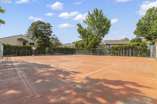 view of sport court featuring basketball hoop