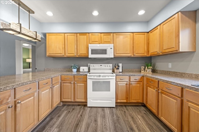 kitchen with kitchen peninsula, dark hardwood / wood-style floors, and white appliances