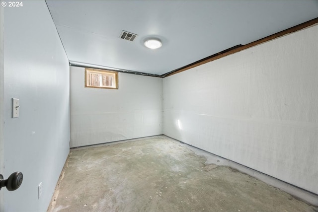 unfurnished room featuring concrete flooring