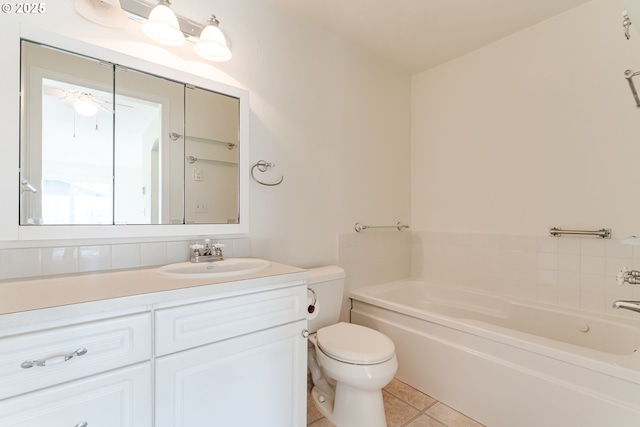 bathroom with vanity, tile patterned floors, toilet, and a bathing tub