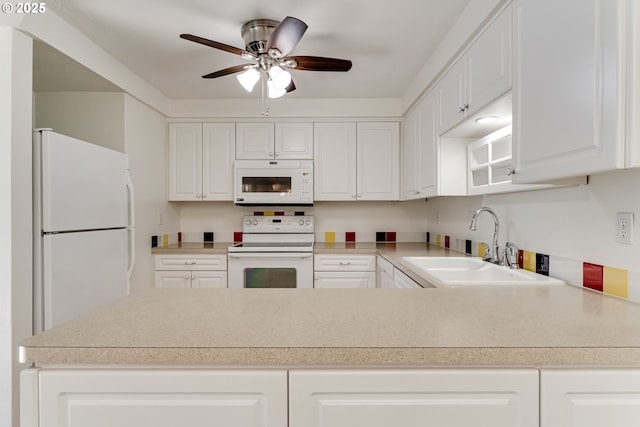 kitchen with white cabinetry, white appliances, ceiling fan, and sink