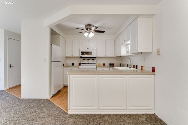 kitchen featuring ceiling fan, white appliances, sink, and white cabinets