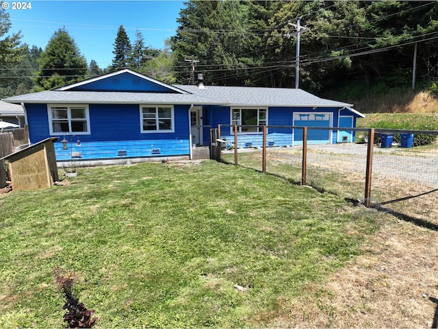 single story home with a garage and a front lawn