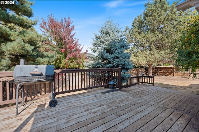 wooden deck featuring grilling area