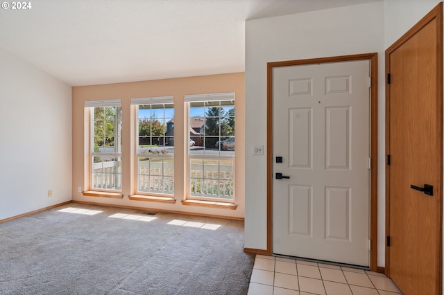 entryway with light carpet