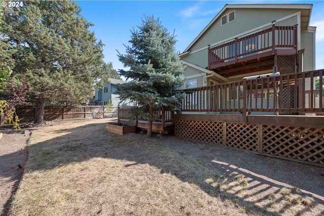 rear view of property with a wooden deck