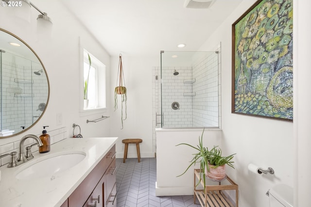 4524 NE 41st Ave, Portland, OR 97211 - bathroom featuring vanity, a walk in shower, tile patterned flooring, recessed lighting, and baseboards