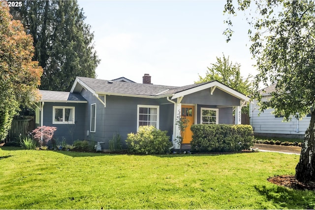 4524 NE 41st Ave, Portland, OR 97211 - single story home with a chimney, a front lawn, and roof with shingles
