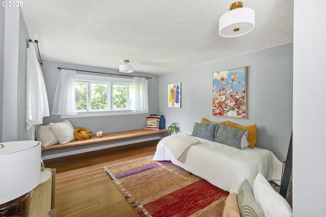 4524 NE 41st Ave, Portland, OR 97211 - bedroom featuring wood finished floors and a textured ceiling