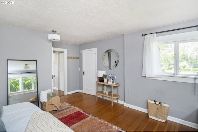 4524 NE 41st Ave, Portland, OR 97211 - bedroom featuring wood finished floors and a textured ceiling