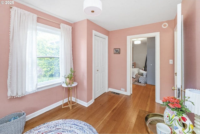 4524 NE 41st Ave, Portland, OR 97211 - entrance foyer with light wood-type flooring, baseboards, healthy amount of natural light, and radiator heating unit