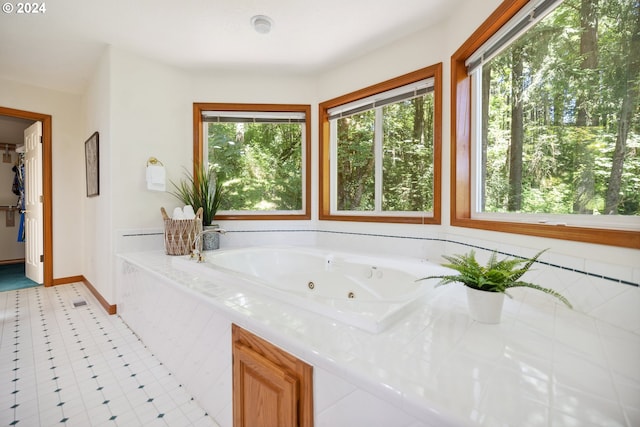 bathroom featuring tiled bath