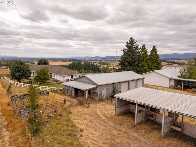 bird's eye view featuring a mountain view and a rural view