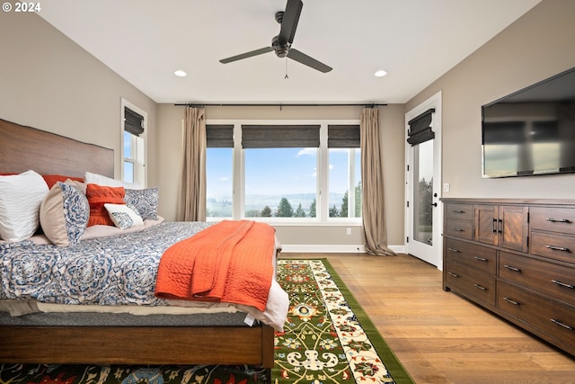 bedroom featuring ceiling fan and light hardwood / wood-style floors